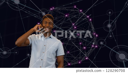 Talking on smartphone, African American man with digital network graphics behind 128290708