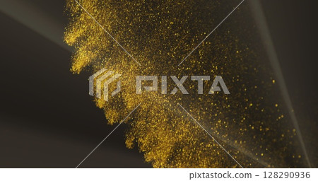 Image of multiple glowing gold glitter particles falling over dark background 128290936