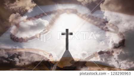 Image of christian cross, rosary and holy bible over clouds 128290963