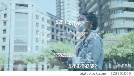 Image of multiple changing numbers floating against woman wearing face mask using smartphone Image of multiple changing numbers floating against woman wearing face mask using smartphone 128291060
