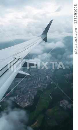 Best clouds view from window plane from holiday travel journey or business trip 128291098