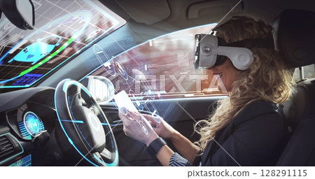 Image of digital interface over woman wearing vr headset in self driving car 128291115