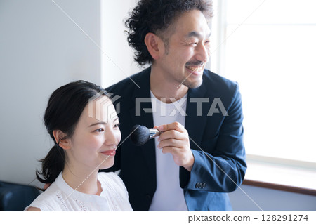 Men and women with makeup brushes holding makeup brushes Image of makeup 128291274