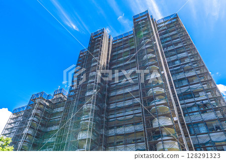 Yokohama cityscape in Japan - Summer sky... View of scaffolding and protective nets for repairs and inspections of apartment buildings - July 10th 128291323