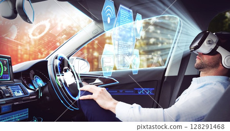 Image of icons over businessman wearing vr headset in self driving car 128291468