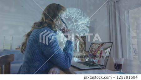 Image of digital human head, network of connections over woman using laptop on image call 128291694