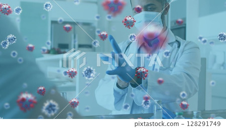 Covid-19 cells floating against mid section of male doctor wearing surgical gloves 128291749