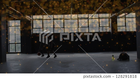 Orange spots moving against african american man and woman practicing basketball Orange spots moving against african american man and woman practicing basketball 128291818