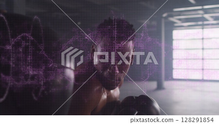 Digital composite image of purple digital waves against male boxer punching a punching bag Digital composite image of purple digital waves against male boxer punching a punching bag 128291854