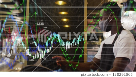 Image of red cubes with per cent sign over man wearing face mask working in cafe 128291865