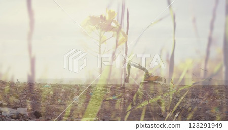 Summer grass over digger in rubbish disposal site 128291949