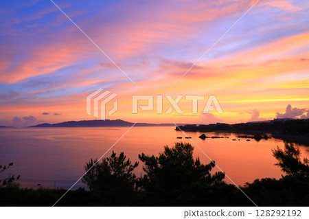 Sunrise over Nago Bay 128292192