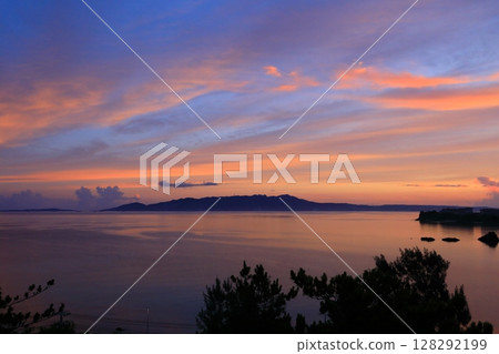 Sunrise over Nago Bay 128292199