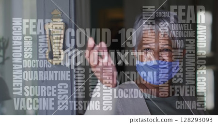 Covid-19 text concept text against african american senior woman wearing face mask opening the door Covid-19 text concept text against african american senior woman wearing face mask opening the door 128293093