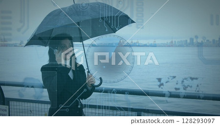 Image of data processing over woman using smartphone carrying umbrella in background Image of data processing over woman using smartphone carrying umbrella in background 128293097