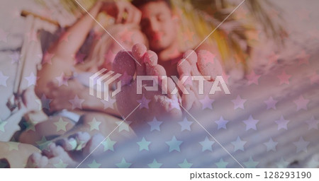 Multiple blinking stars against caucasian couple lying on the hammock at the beach 128293190