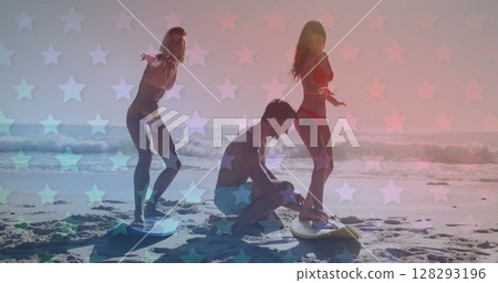 Multiple blinking stars against group of friends practicing surfing at the beach Multiple blinking stars against group of friends practicing surfing at the beach 128293196