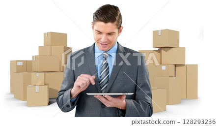 Image of businessman using tablet with stacks of boxes on white background 128293236