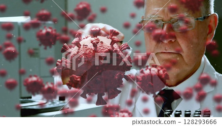 Scientist in laboratory examining virus model, focusing on research and analysis Scientist in laboratory examining virus model, focusing on research and analysis 128293666