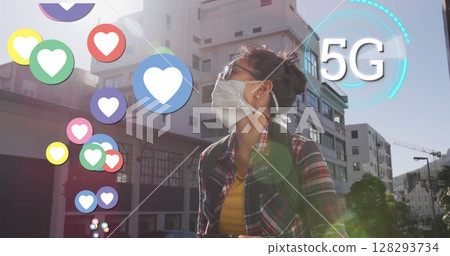 Asian woman wearing mask outdoors surrounded by digital 5G icons and graphics 128293734