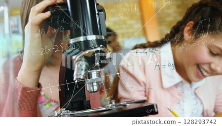 In school, students using microscope and laughing, enjoying science class activities In school, students using microscope and laughing, enjoying science class activities 128293742