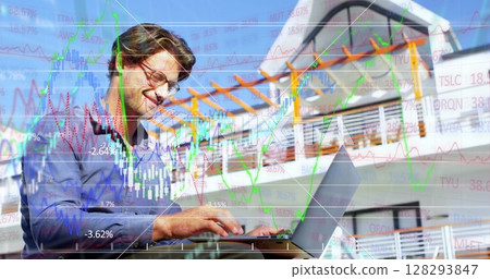Businessman analyzing stock market data on laptop, smiling confidently outdoors 128293847