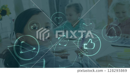 In classroom, children interacting with digital icons while studying together 128293869
