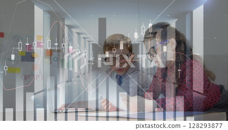In school, children using tablets, analyzing digital graphs, learning tech skills 128293877