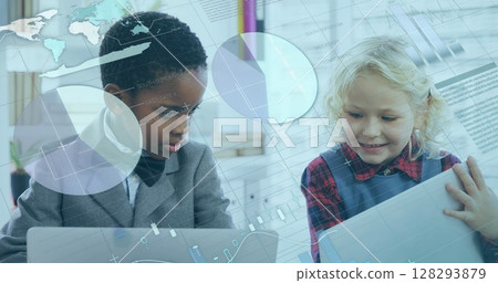 In school, children using laptops and exploring digital interfaces with curiosity In school, children using laptops and exploring digital interfaces with curiosity 128293879