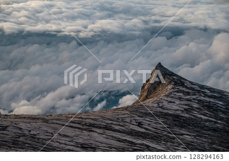 Scenery view of an iconic peak named South Peak on Mt.Kinabalu, Malaysia before sunrise. Mount Kinabalu is the tallest mountain in Malaysia and Borneo. 128294163