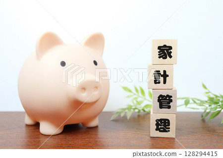 Photo of a piggy bank and building blocks for household management - saving image Photo of a piggy bank and building blocks for household management - saving image 128294415