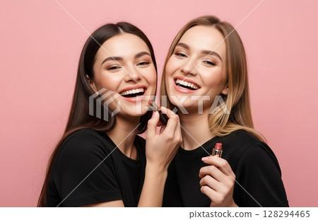 Close friends stand side by side applying lipstick and grinning warmly, expressing self-love and beauty in casual everyday moment 128294465