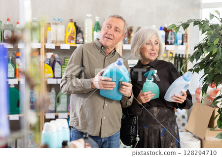 Elderly couple opting for cleaning spray and detergent 128294710