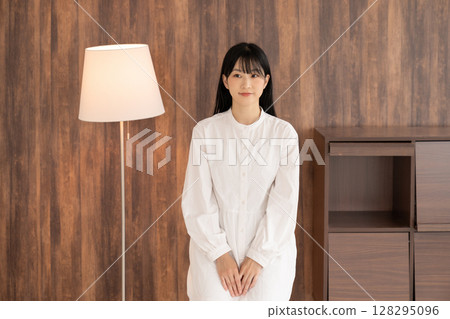 A young woman relaxing in the room 128295096
