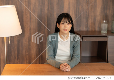 A young woman relaxing in the room 128295097