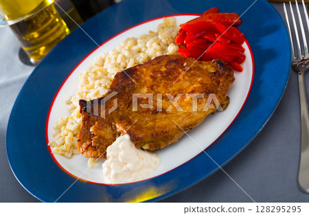 Beef steak and pearl barley with red bell pepper 128295295