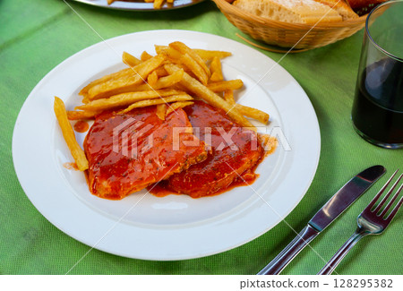 Baked loin with sauce and potatoes 128295382