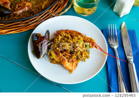 Paella on white plate Paella on white plate 128295465