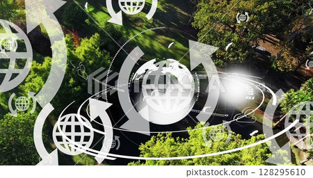 Image of globe icons with arrows and globe spinning over landscape 128295610
