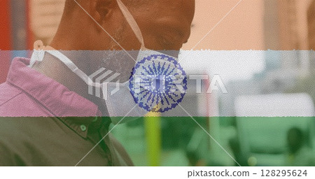 Composition of man wearing face mask over indian flag 128295624