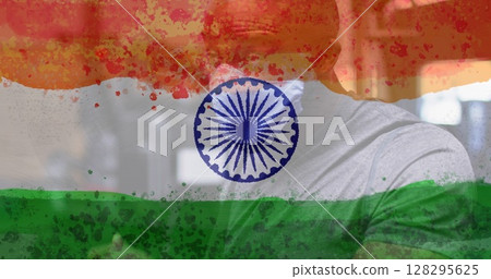 Composition of man wearing face mask over indian flag 128295625