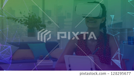 Image of networks of connections over woman wearing vr headset in background 128295677