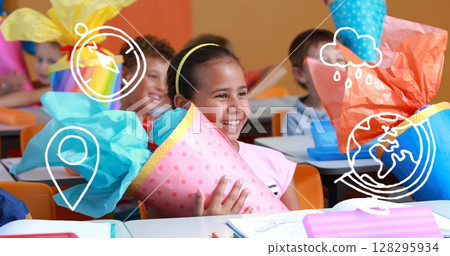 Image of school icons over school children in classroom Image of school icons over school children in classroom 128295934