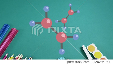 Image of 3d molecular models over stationery and school equipment on green table top 128295955