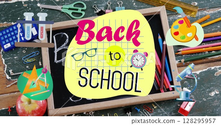 Back to school text against wooden slate and school equipment on wooden table Back to school text against wooden slate and school equipment on wooden table 128295957