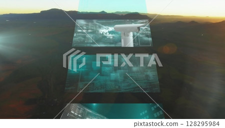 Futuristic digital screens displaying data and technology against mountain backdrop 128295984