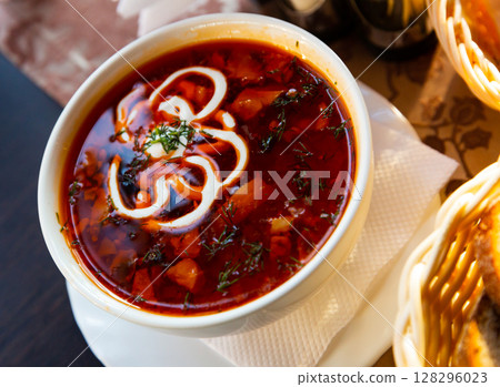 Traditional Russian meat soup solyanka with assorted meat and sausages and vegetables Traditional Russian meat soup solyanka with assorted meat and sausages and vegetables 128296023