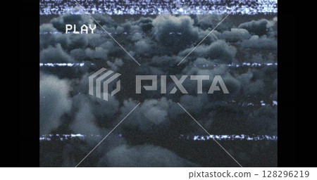 Vintage VHS effect with static clouds creating nostalgic retro atmosphere Vintage VHS effect with static clouds creating nostalgic retro atmosphere 128296219