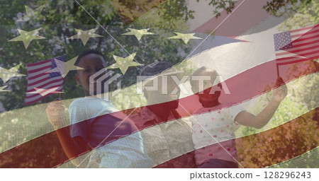 Image of male soldier embracing smiling daughter and son over american flag 128296243