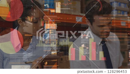 Statistical data processing against diverse male and female supervisor checking stock at warehouse 128296453